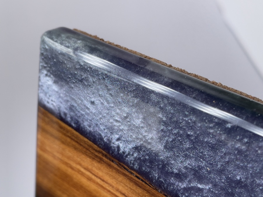 Close-up of epoxy and timber coaster edge showing resin depth and detail