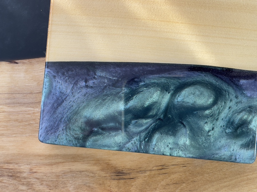 Close-up of teal and purple epoxy swirl detail