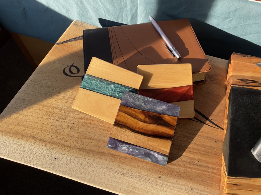 Epoxy coasters arranged on an open journal