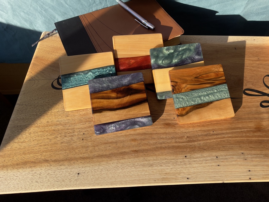 Spread of epoxy coasters made from mixed Tasmanian timbers